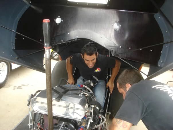 Working inside a race car during preparation